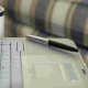 laptop with pen for mortgage planning