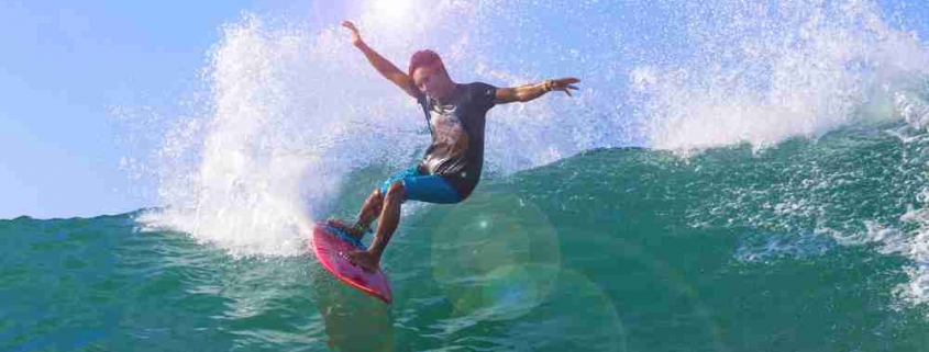 man surfing on waves: riding out interest rate hikes