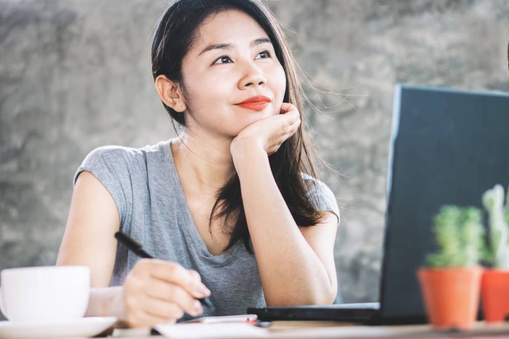 lady smiling over being debt free of mortgage
